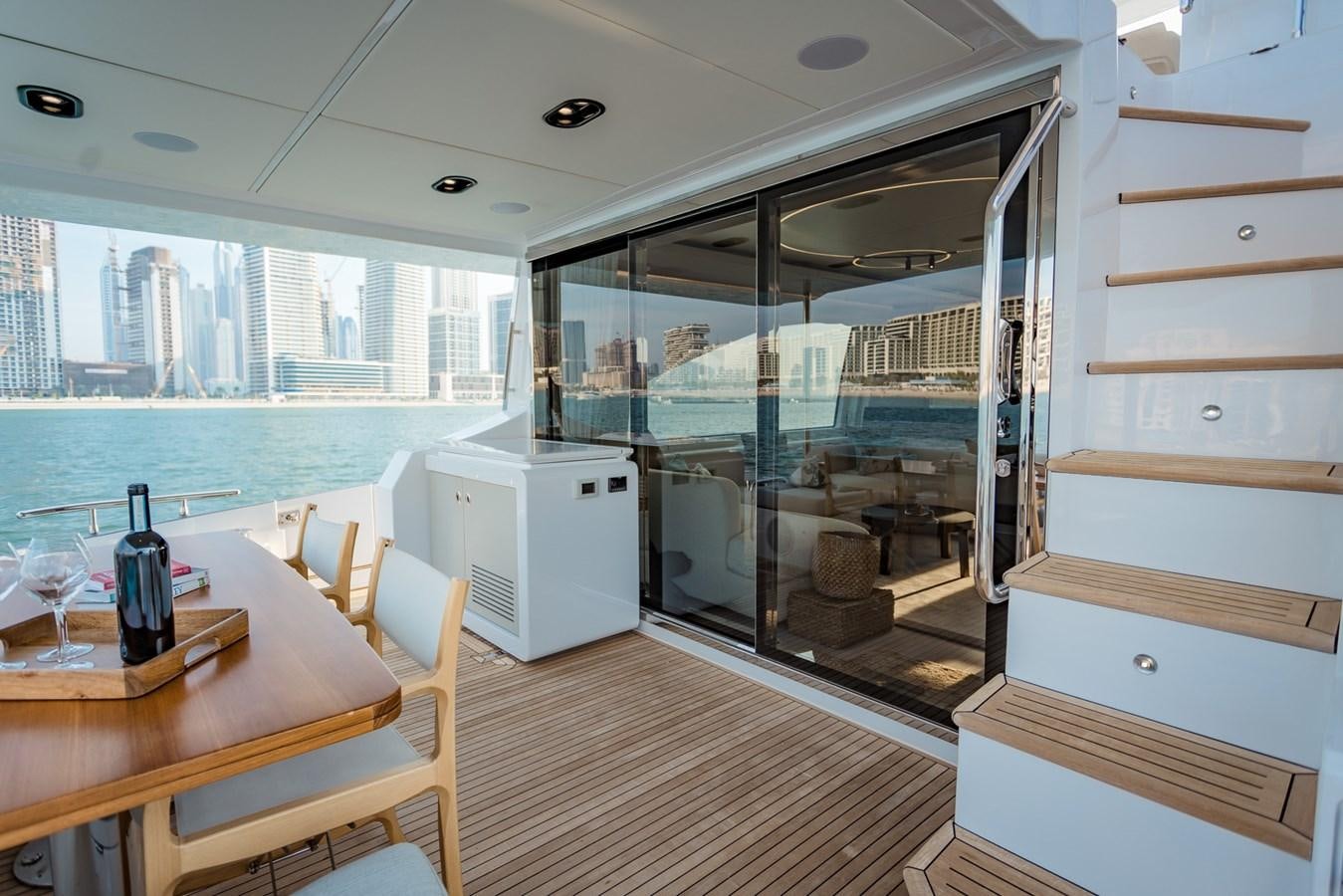 a room with a table and chairs aboard ATLANTIS Yacht for Sale