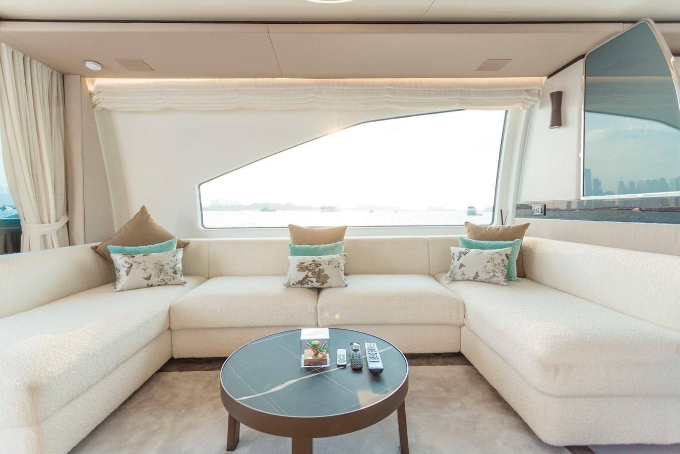 a couch with a coffee table aboard ATLANTIS Yacht for Sale