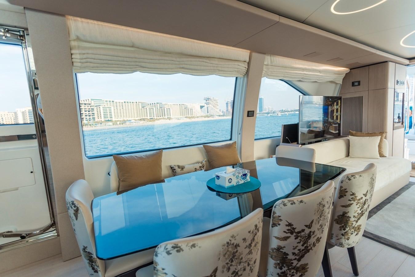 a room with a view of the ocean and a city aboard ATLANTIS Yacht for Sale