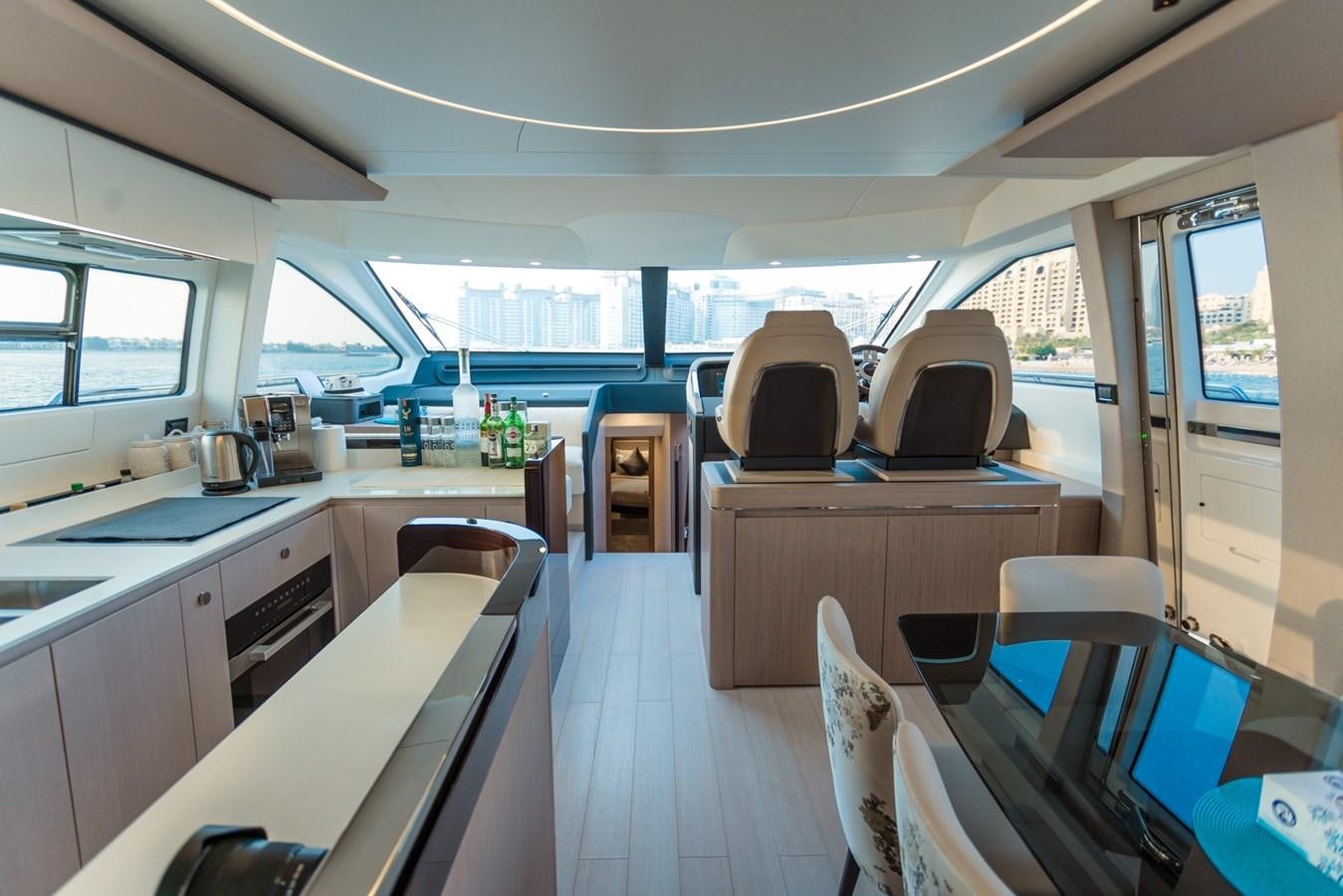 a large kitchen with a large window aboard ATLANTIS Yacht for Sale