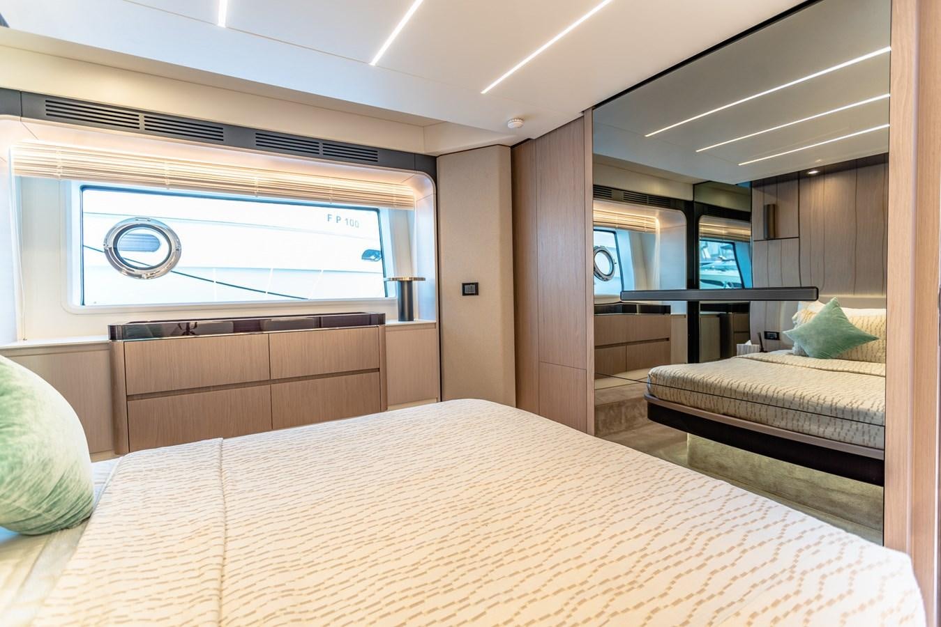a bedroom with a bed and a window aboard ATLANTIS Yacht for Sale