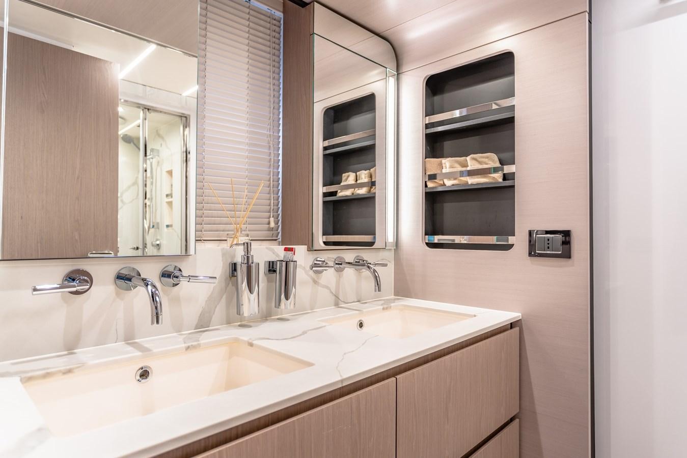 a bathroom with a sink and a mirror aboard ATLANTIS Yacht for Sale