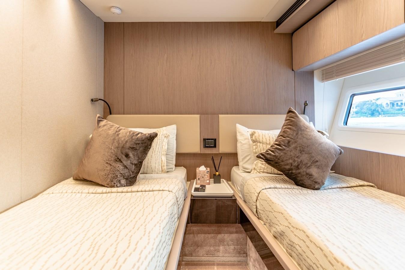 a couple of beds in a room aboard ATLANTIS Yacht for Sale