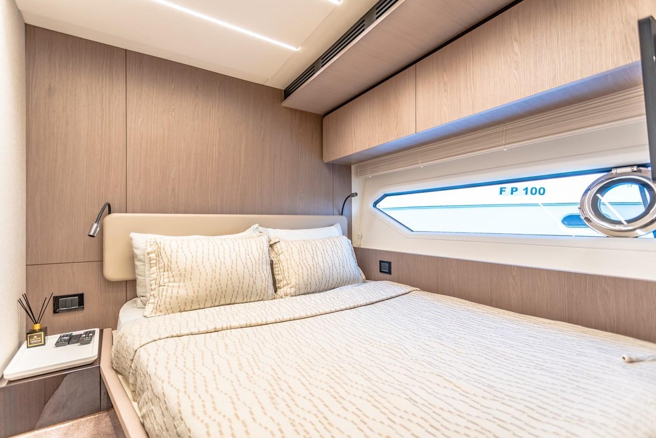 a bed with a white bed aboard ATLANTIS Yacht for Sale