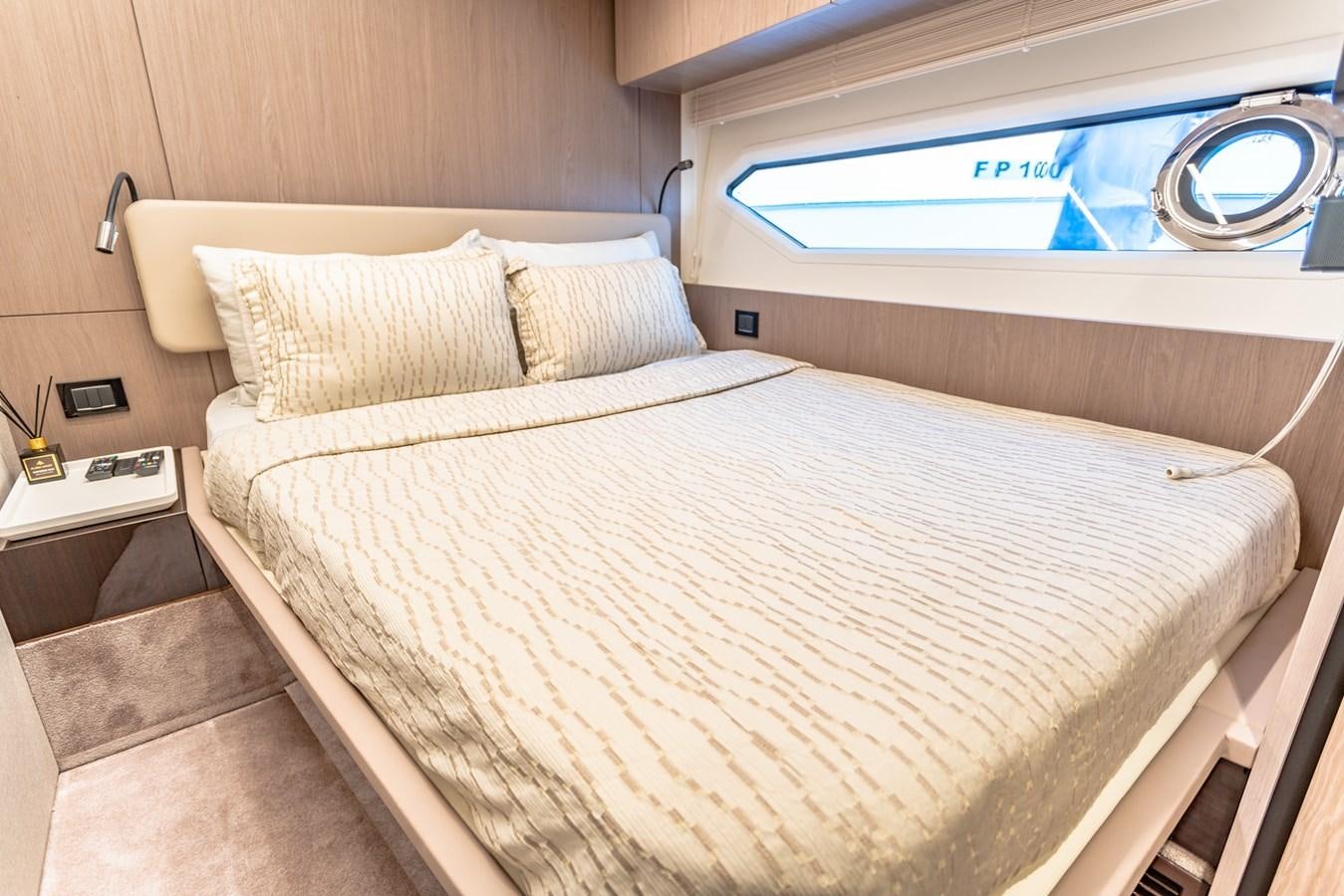 a bed with a white sheet aboard ATLANTIS Yacht for Sale