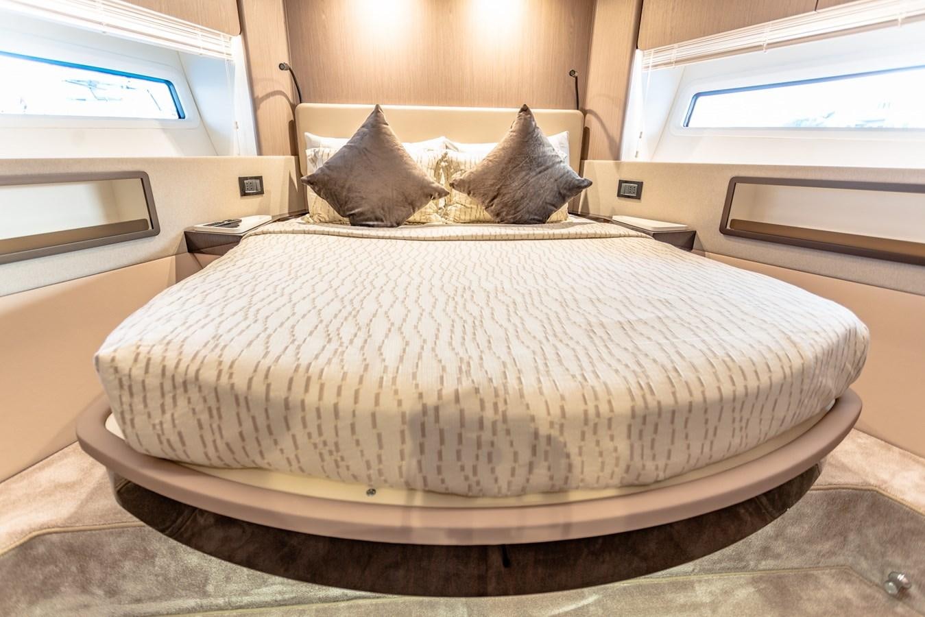 a bed with a white sheet aboard ATLANTIS Yacht for Sale