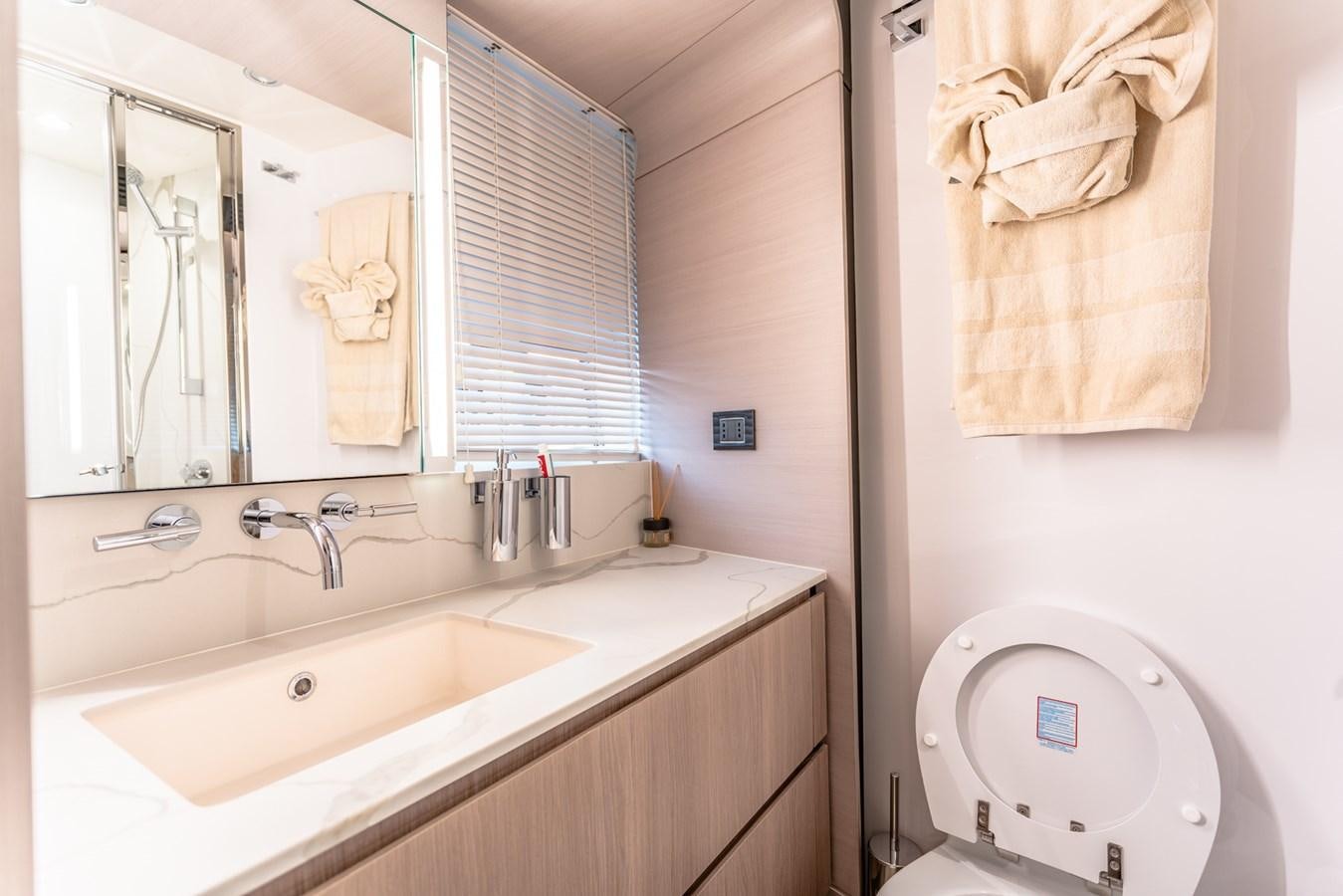 a bathroom with a sink and a toilet aboard ATLANTIS Yacht for Sale