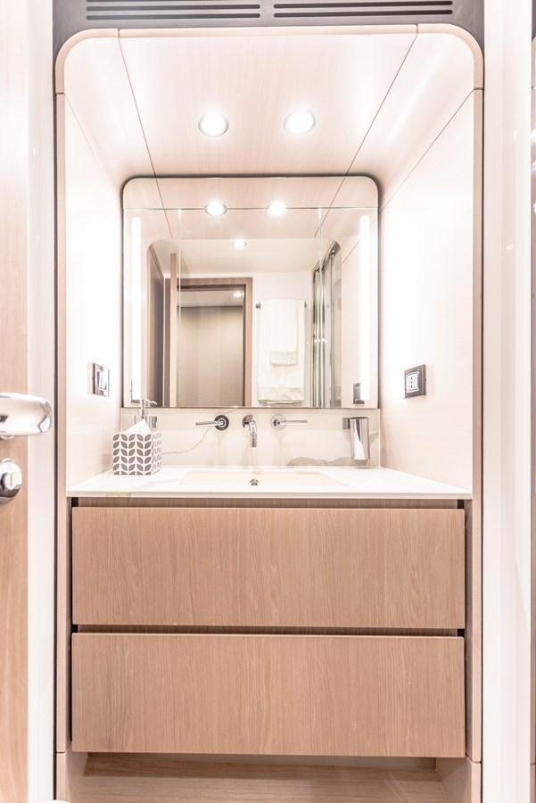 a bathroom with a large mirror aboard ATLANTIS Yacht for Sale