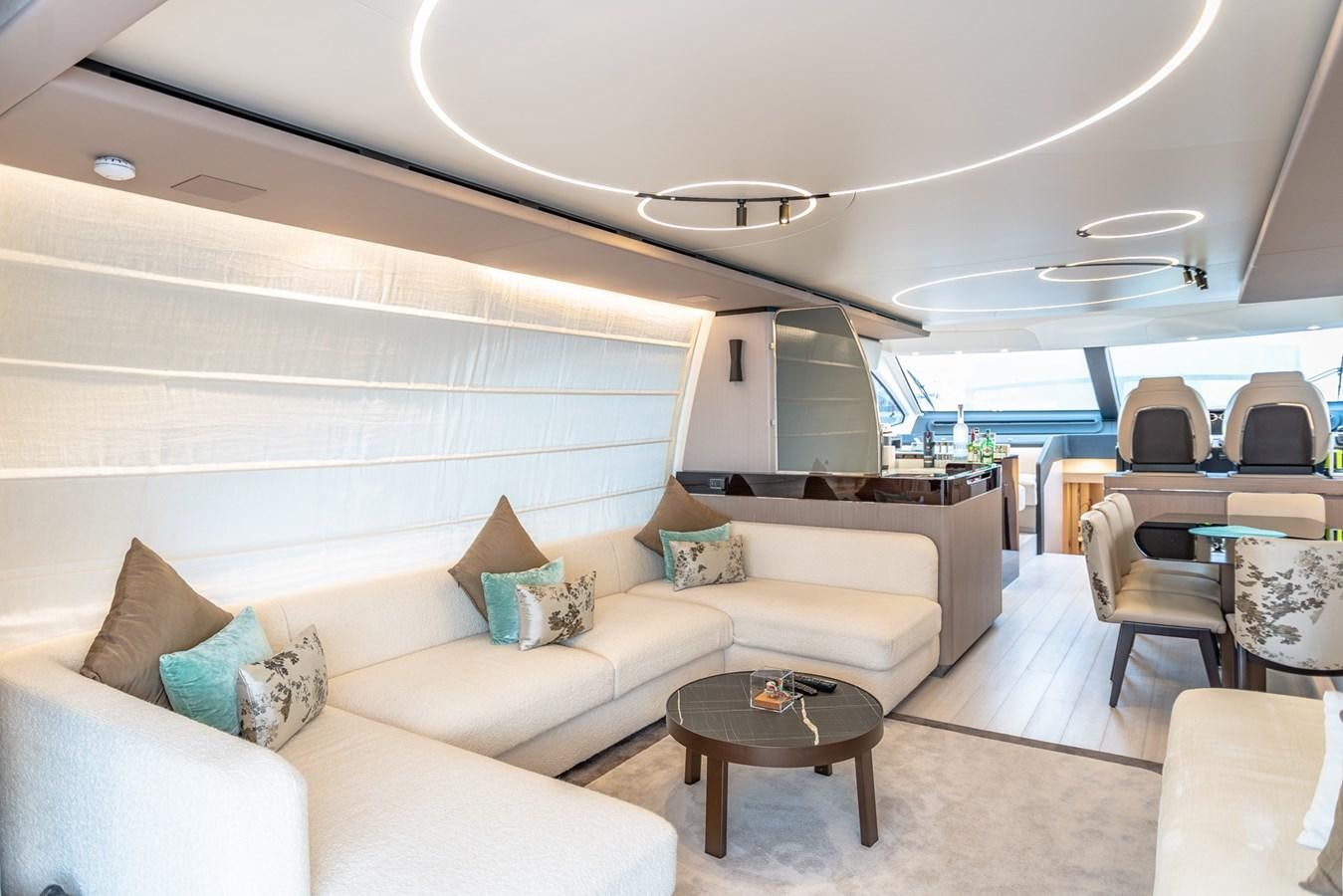 a living room with a couch and a table aboard ATLANTIS Yacht for Sale
