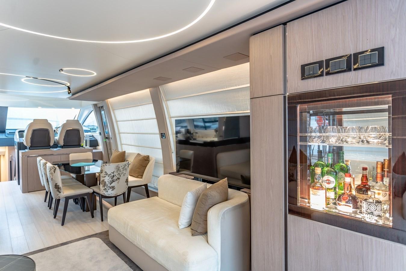 a living room with a glass wall aboard ATLANTIS Yacht for Sale