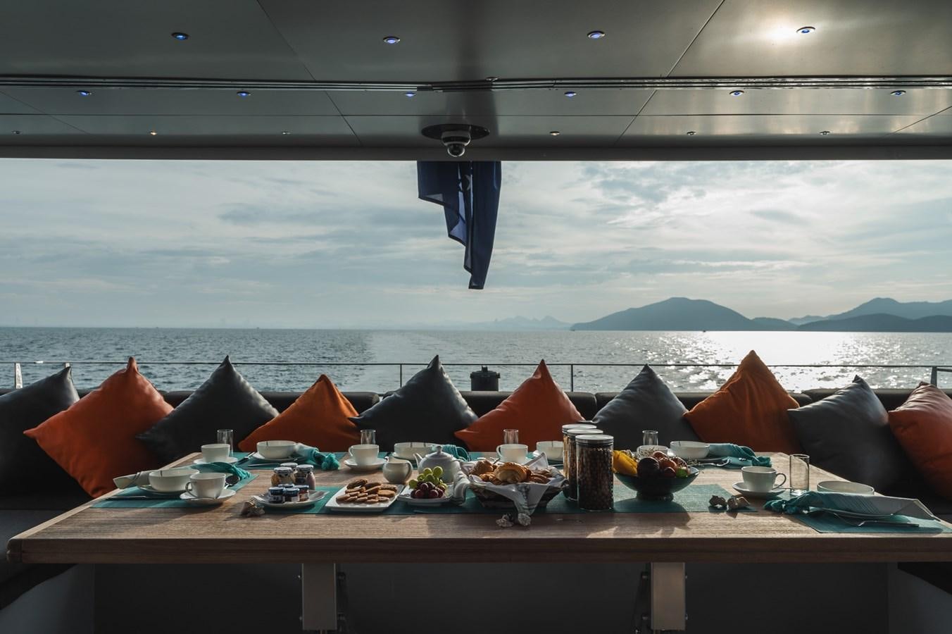 a table with food on it aboard NONNI II Yacht for Sale