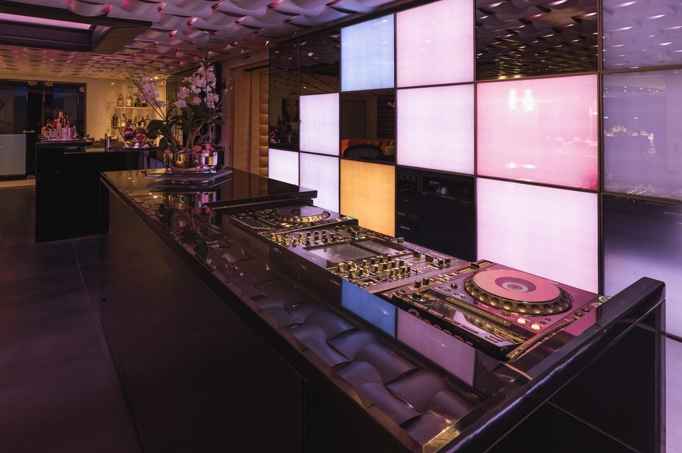 a large bar with a large display aboard NONNI II Yacht for Sale