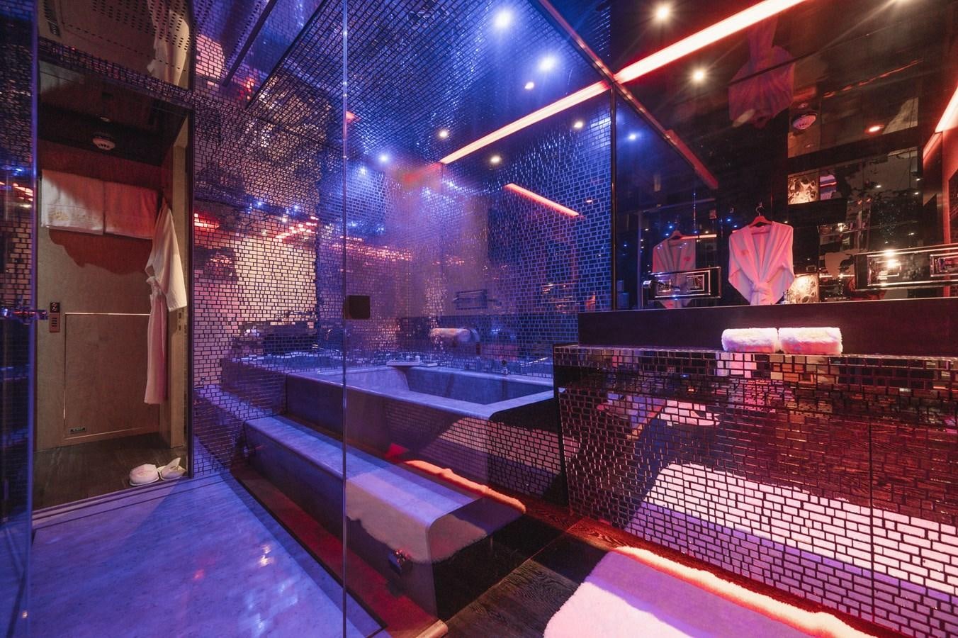 a large bathroom with a large tub aboard NONNI II Yacht for Sale