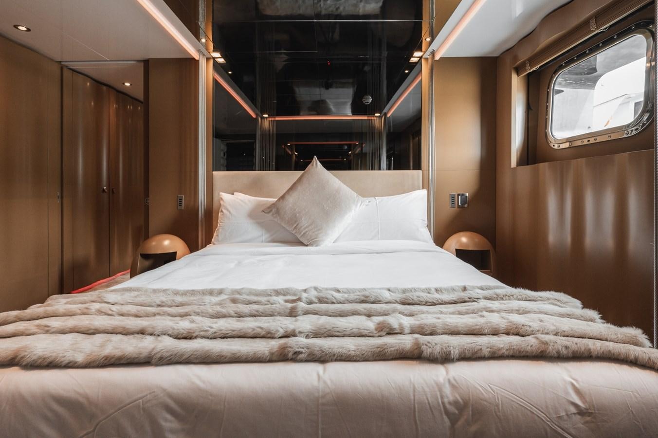 a bed with white sheets aboard NONNI II Yacht for Sale