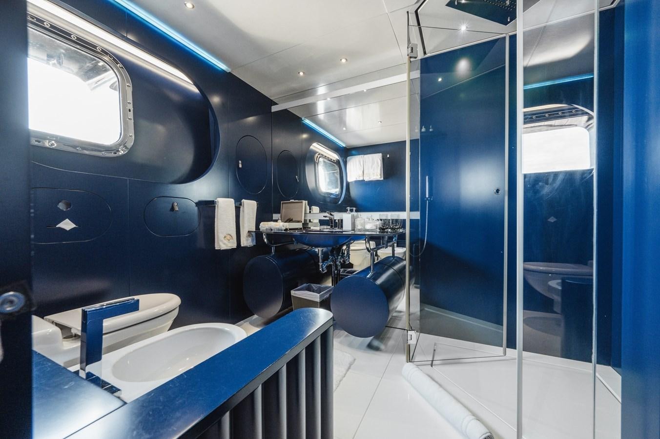 a room with blue walls and a machine aboard NONNI II Yacht for Sale