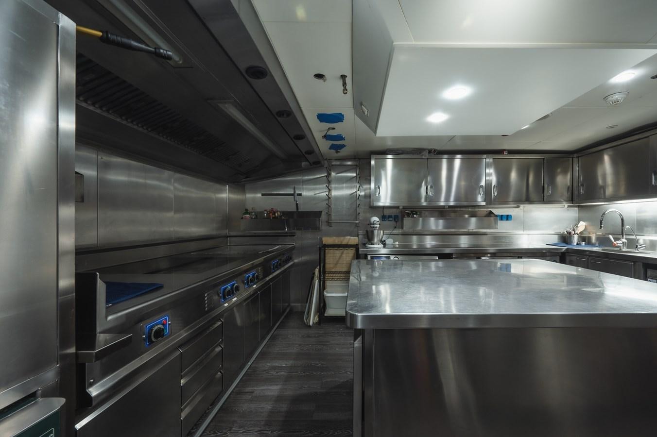 a kitchen with stainless steel appliances aboard NONNI II Yacht for Sale