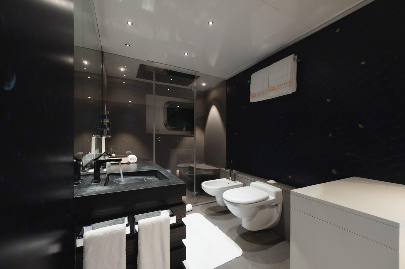 a bathroom with a large mirror aboard NONNI II Yacht for Sale