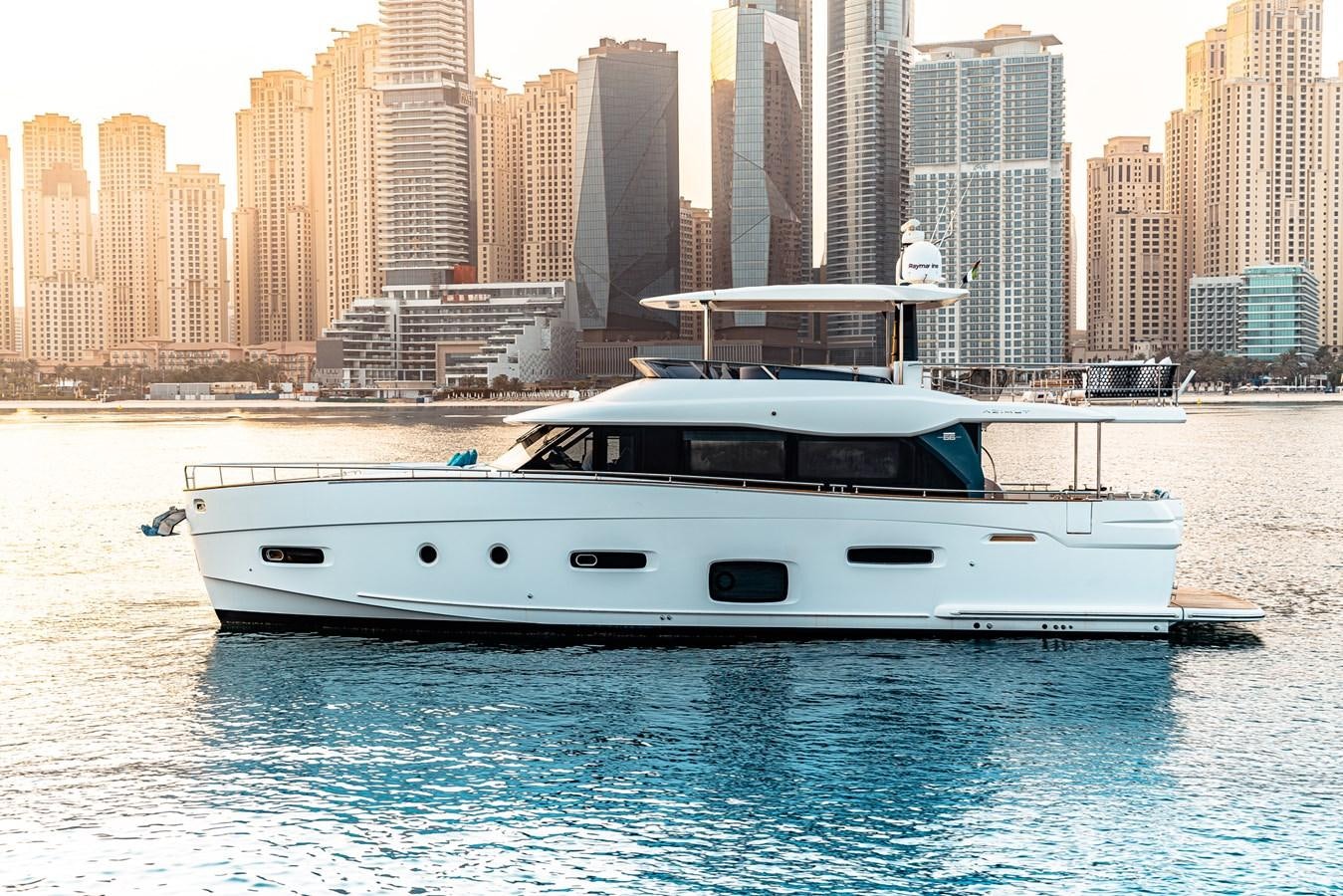 a white yacht in the water aboard FAT BOY Yacht for Sale