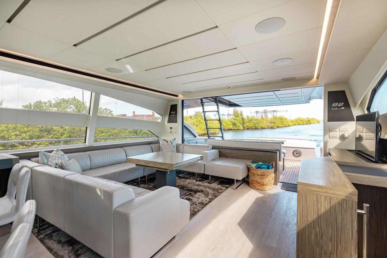 a room with a table and chairs aboard AFRICAN WILD DOG Yacht for Sale
