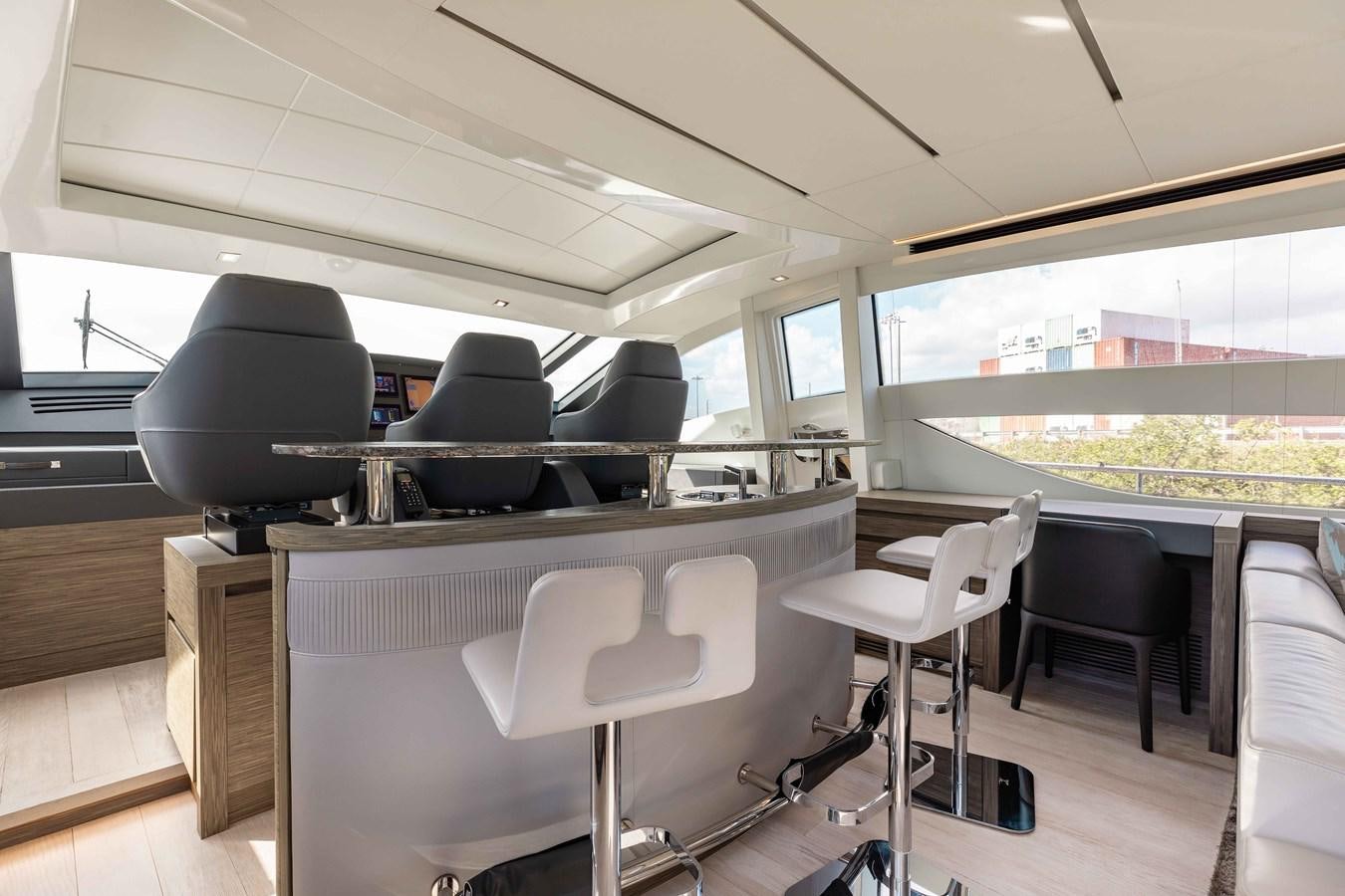 a room with a table and chairs aboard AFRICAN WILD DOG Yacht for Sale