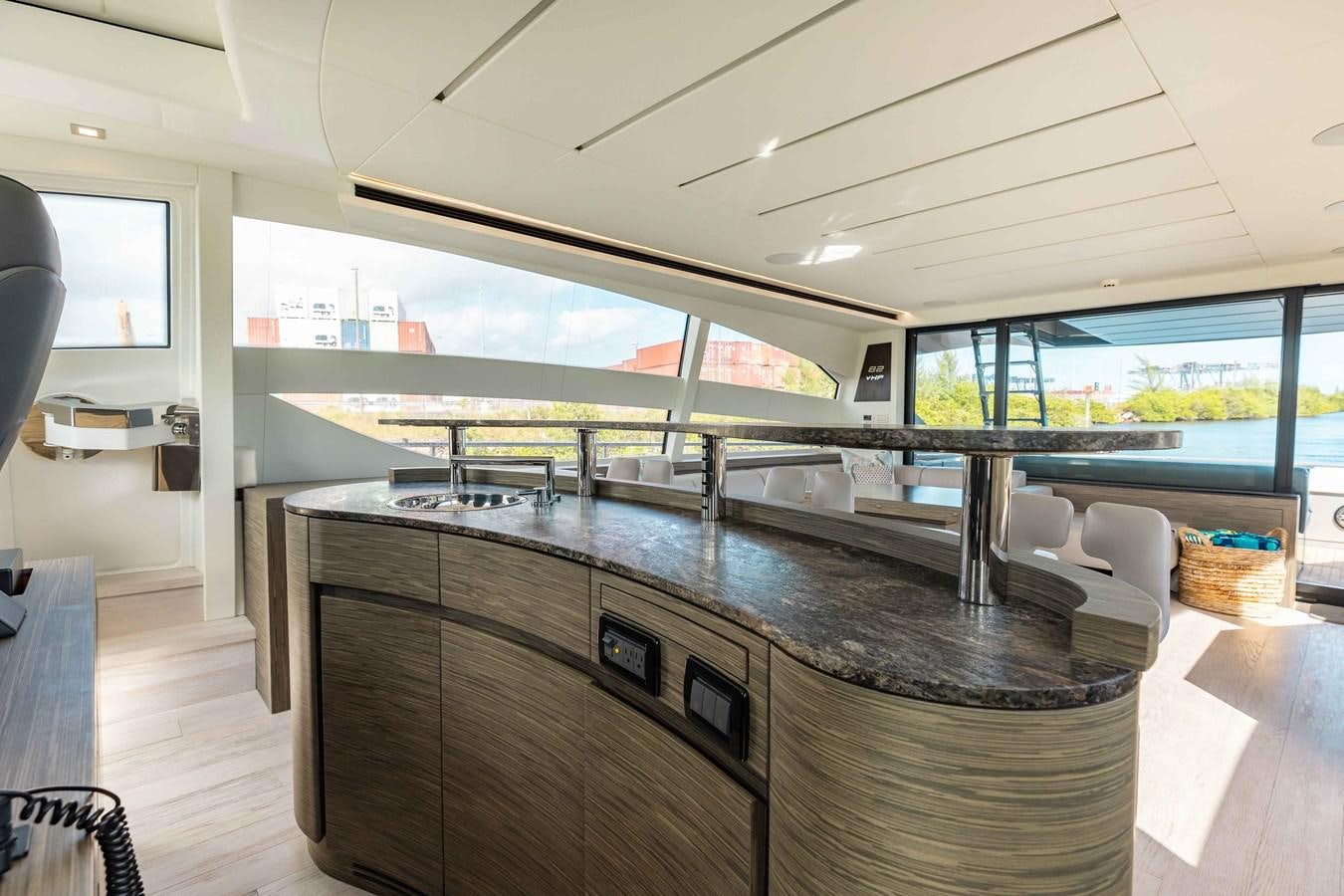 a kitchen with a large island aboard AFRICAN WILD DOG Yacht for Sale