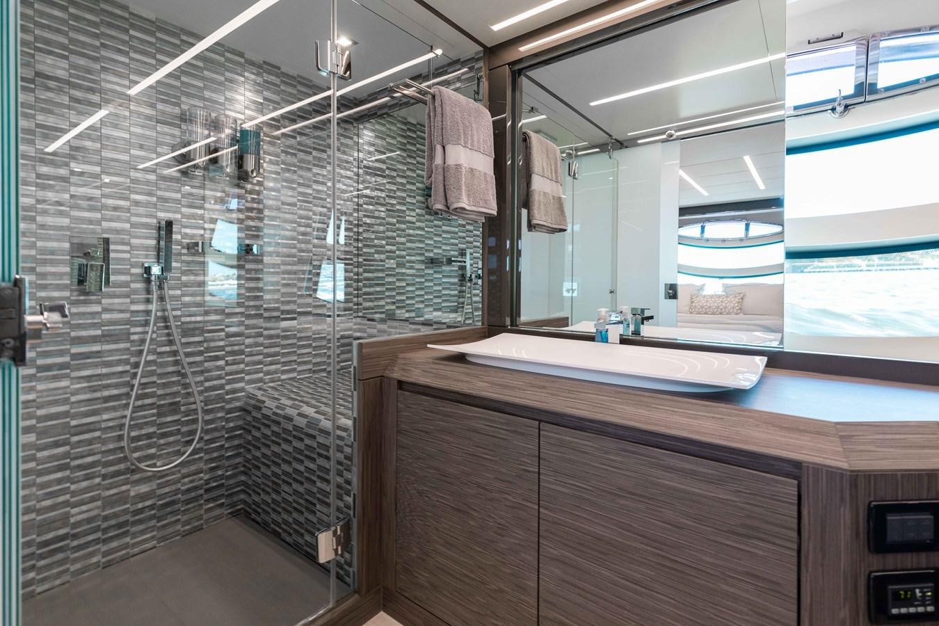 a bathroom with a shower aboard AFRICAN WILD DOG Yacht for Sale