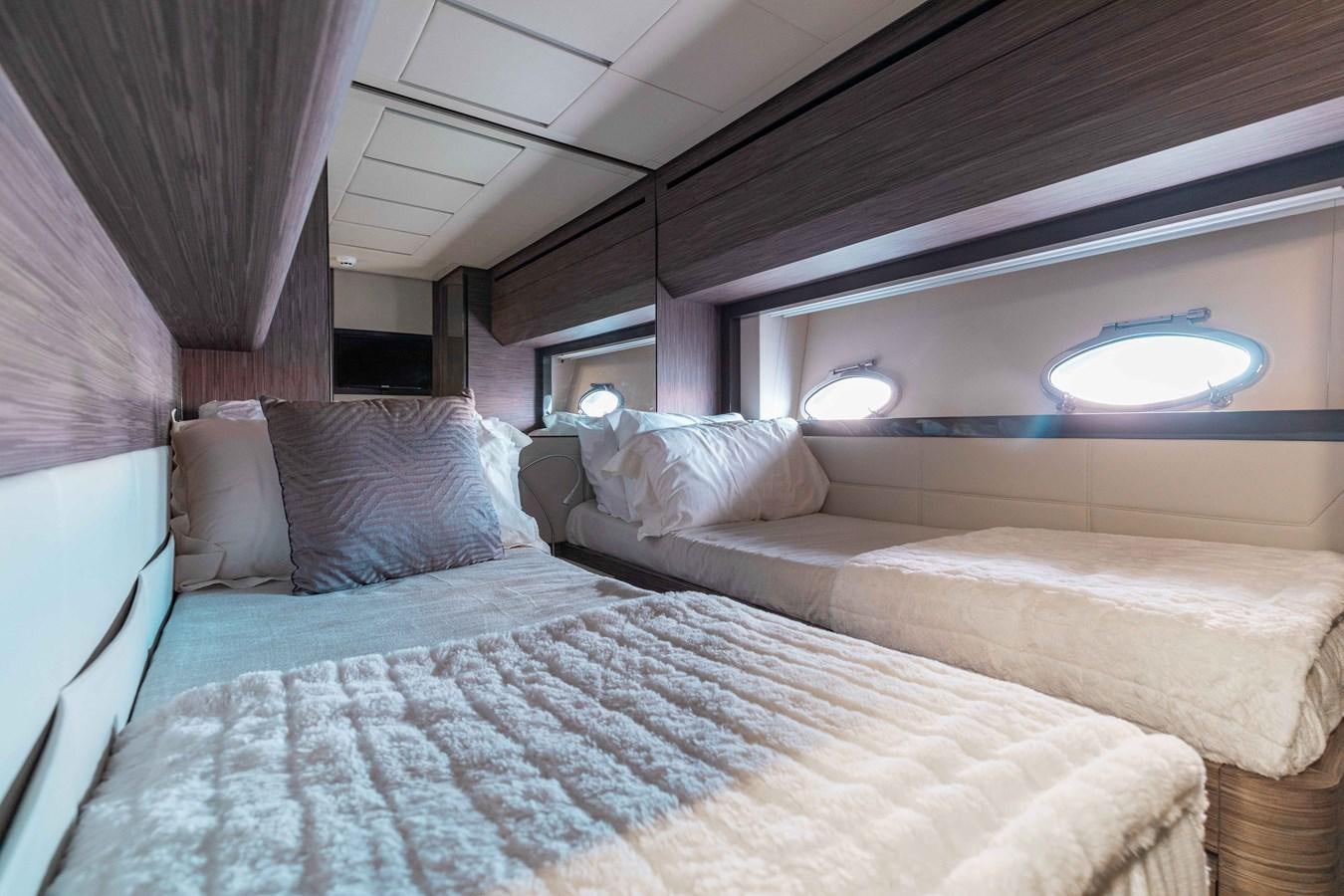 a couple of beds in a room aboard AFRICAN WILD DOG Yacht for Sale
