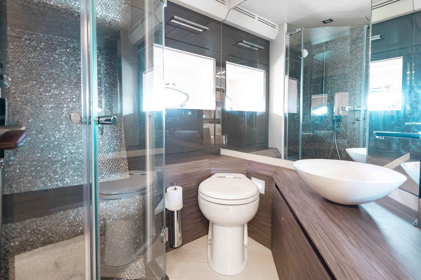 a bathroom with a glass shower aboard AFRICAN WILD DOG Yacht for Sale