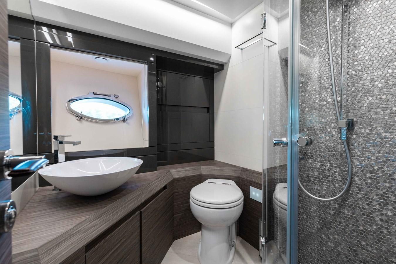 a bathroom with a sink and a toilet aboard AFRICAN WILD DOG Yacht for Sale
