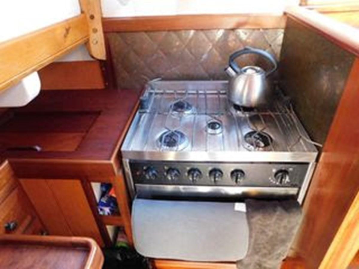 a stove with a tea kettle on top aboard SPIKE AFRICA Yacht for Sale