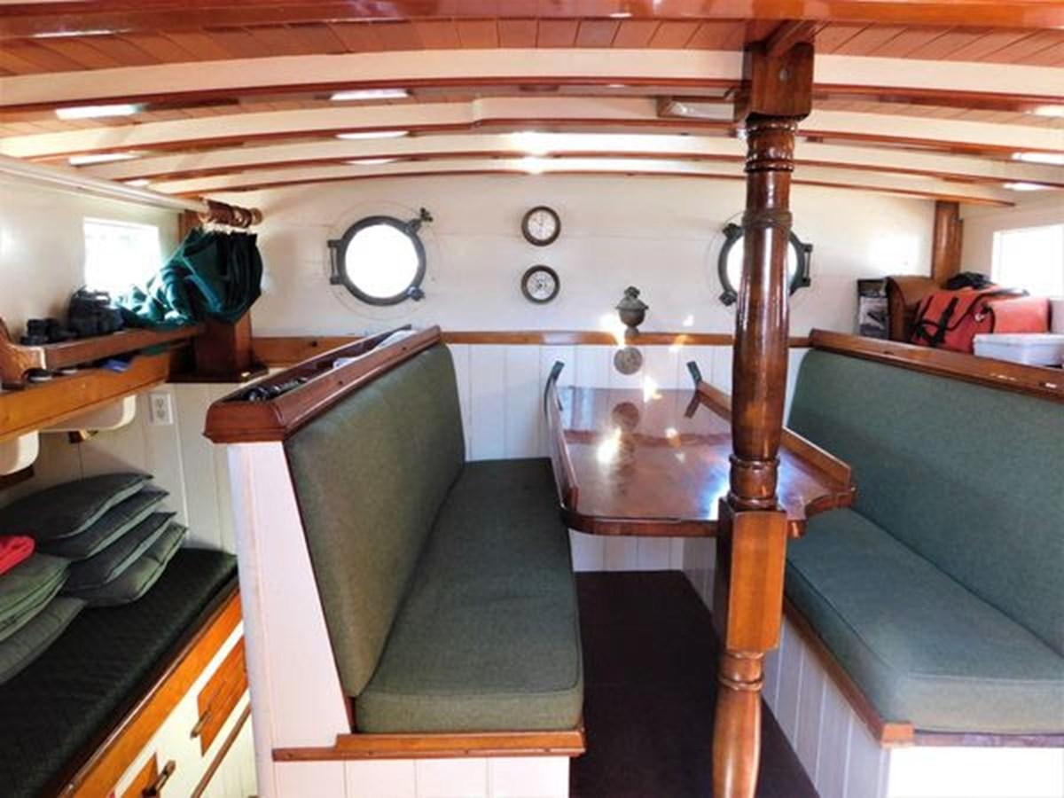 a room with a couch and a table aboard SPIKE AFRICA Yacht for Sale