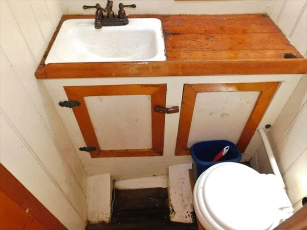 a bathroom with a sink and toilet aboard SPIKE AFRICA Yacht for Sale