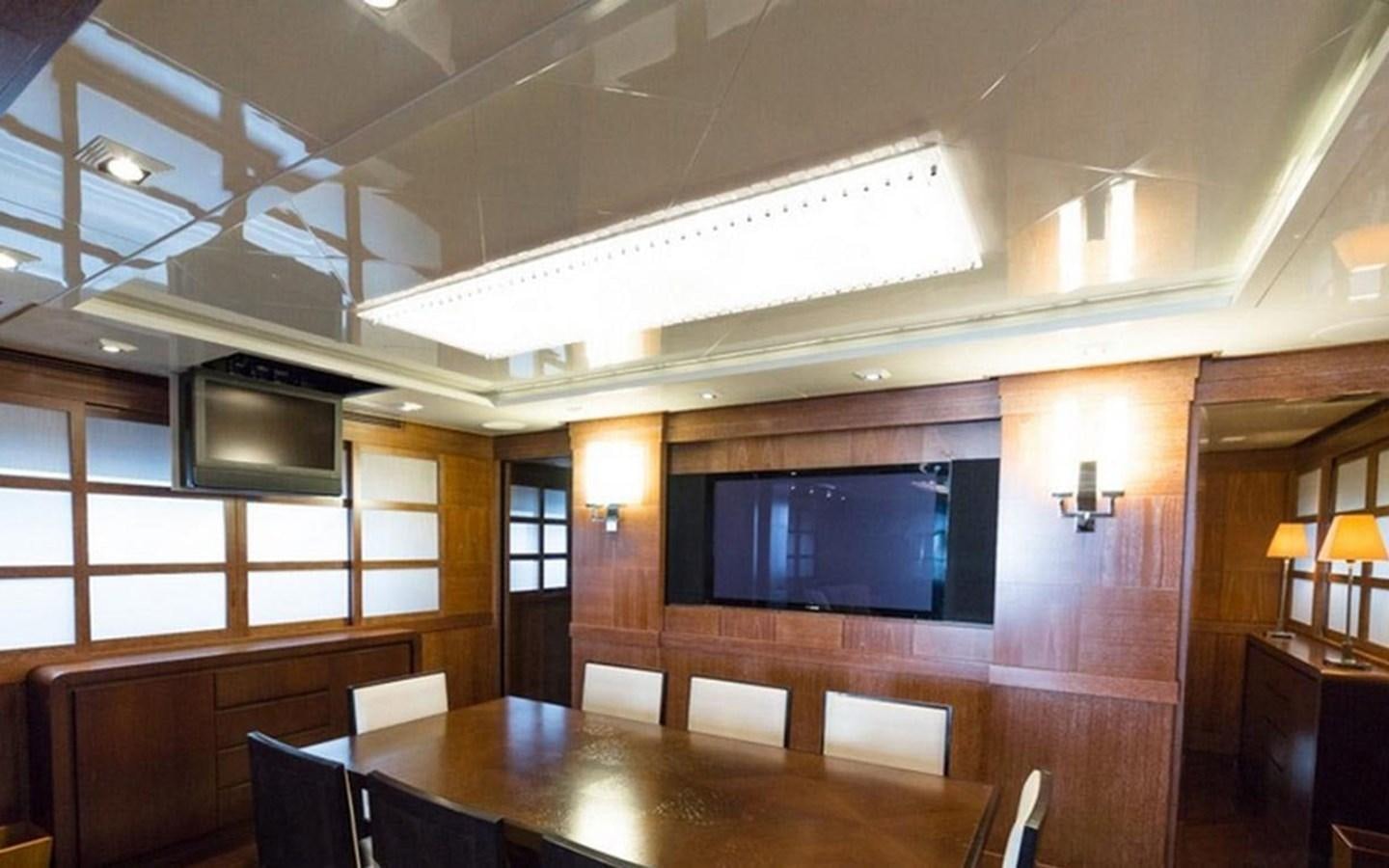 a room with a table and chairs aboard ZOO Yacht for Sale