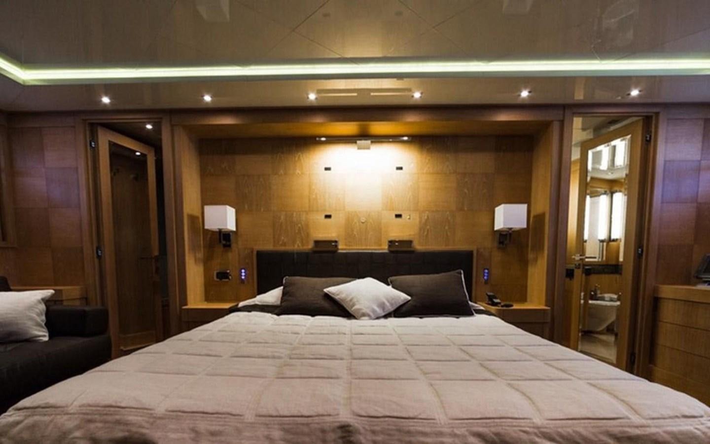 a large bed in a hotel room aboard ZOO Yacht for Sale