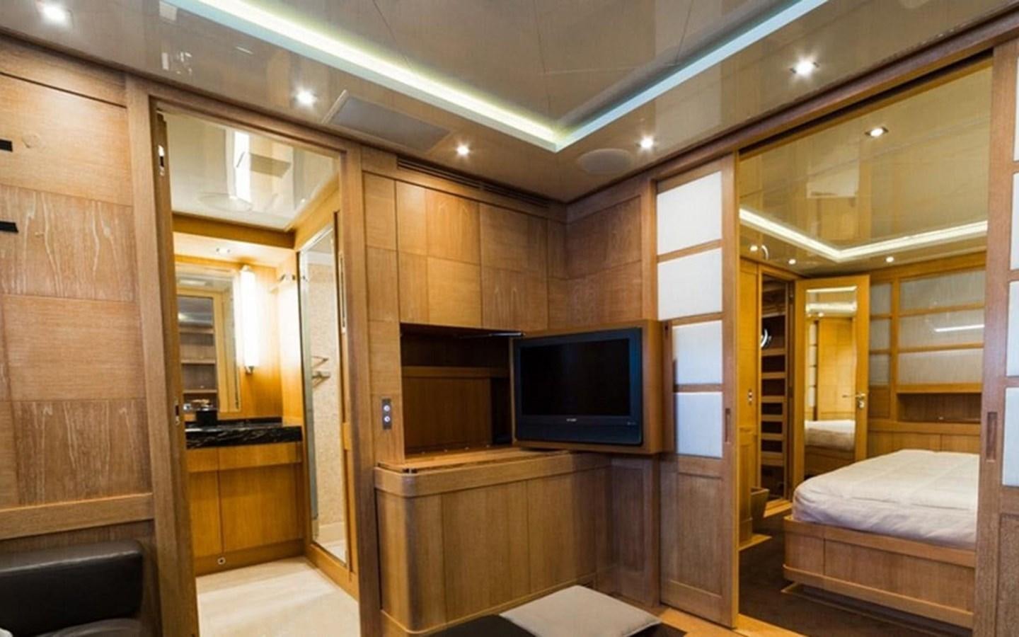 a room with a bed and a tv aboard ZOO Yacht for Sale