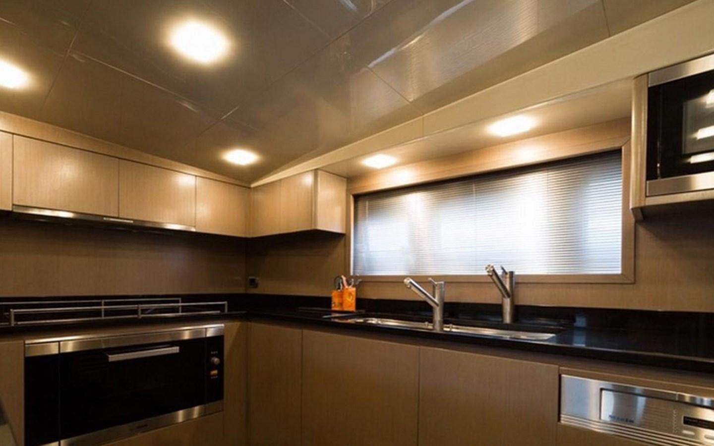 a kitchen with a sink and stove aboard ZOO Yacht for Sale