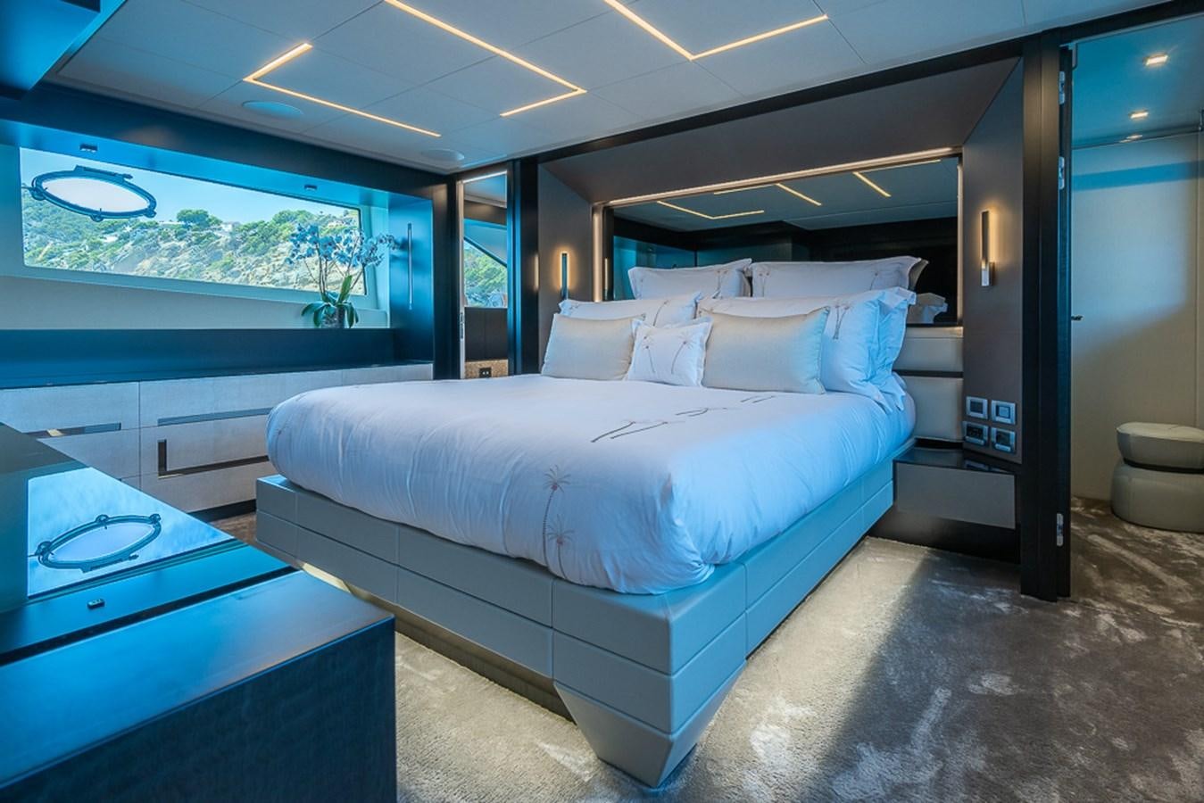 a bed in a room aboard BOMBADIL III Yacht for Sale