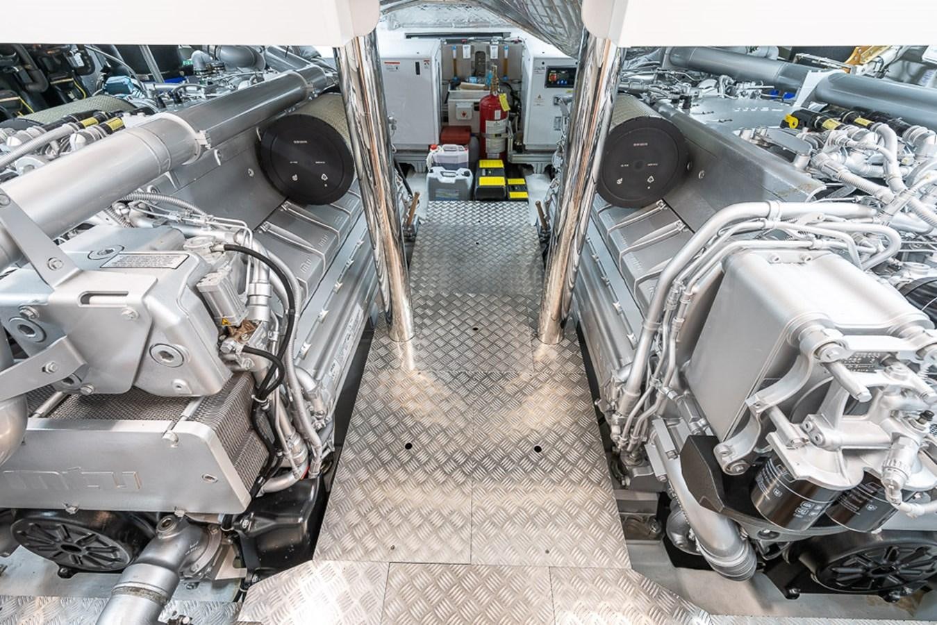 a car with a large engine aboard BOMBADIL III Yacht for Sale