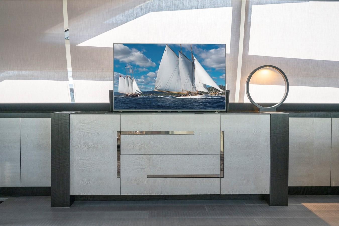 a large white cabinet with a mirror on it aboard BOMBADIL III Yacht for Sale