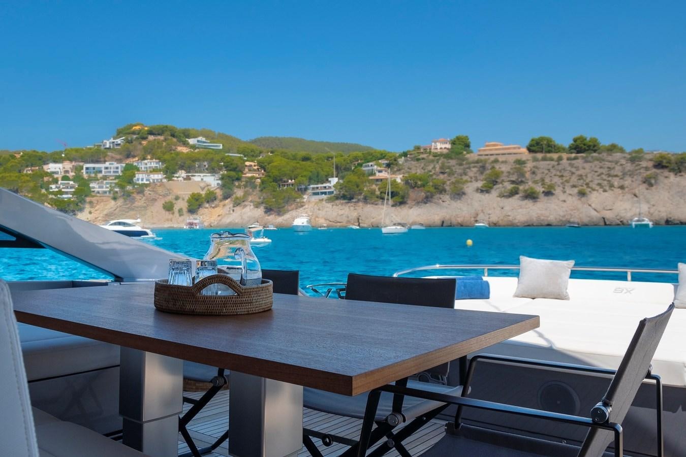 a table with a basket on it aboard BOMBADIL III Yacht for Sale