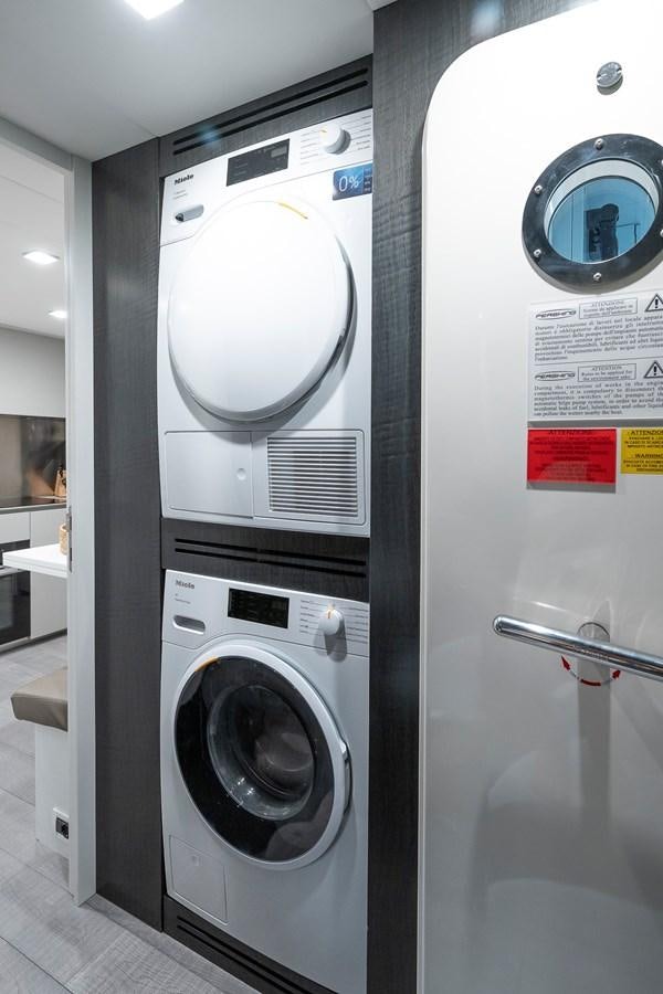a row of washing machines aboard BOMBADIL III Yacht for Sale