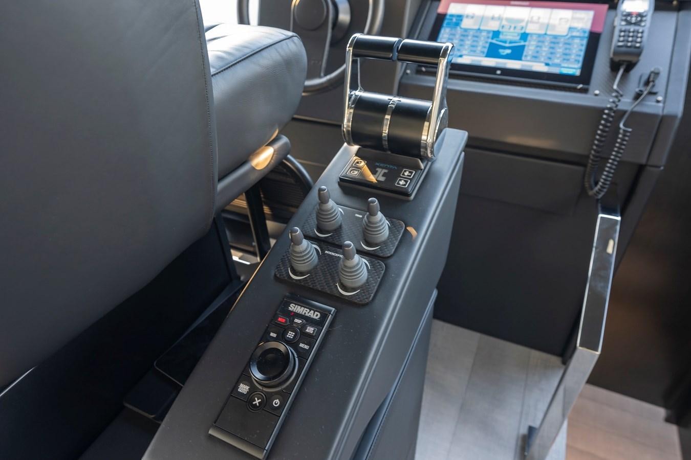 a car with a screen and buttons aboard BOMBADIL III Yacht for Sale