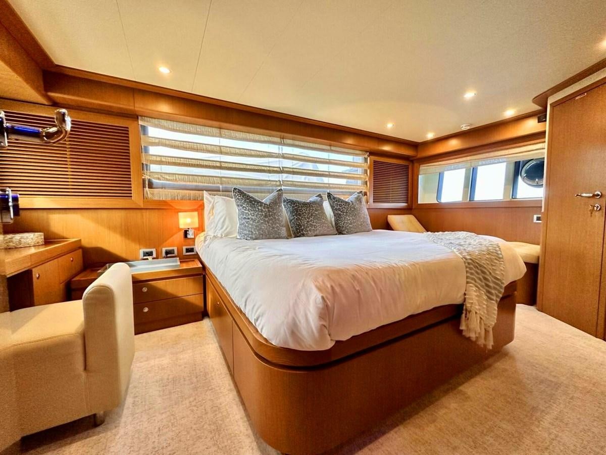 a bedroom with a bed and a desk aboard ALTURA 840 Yacht for Sale