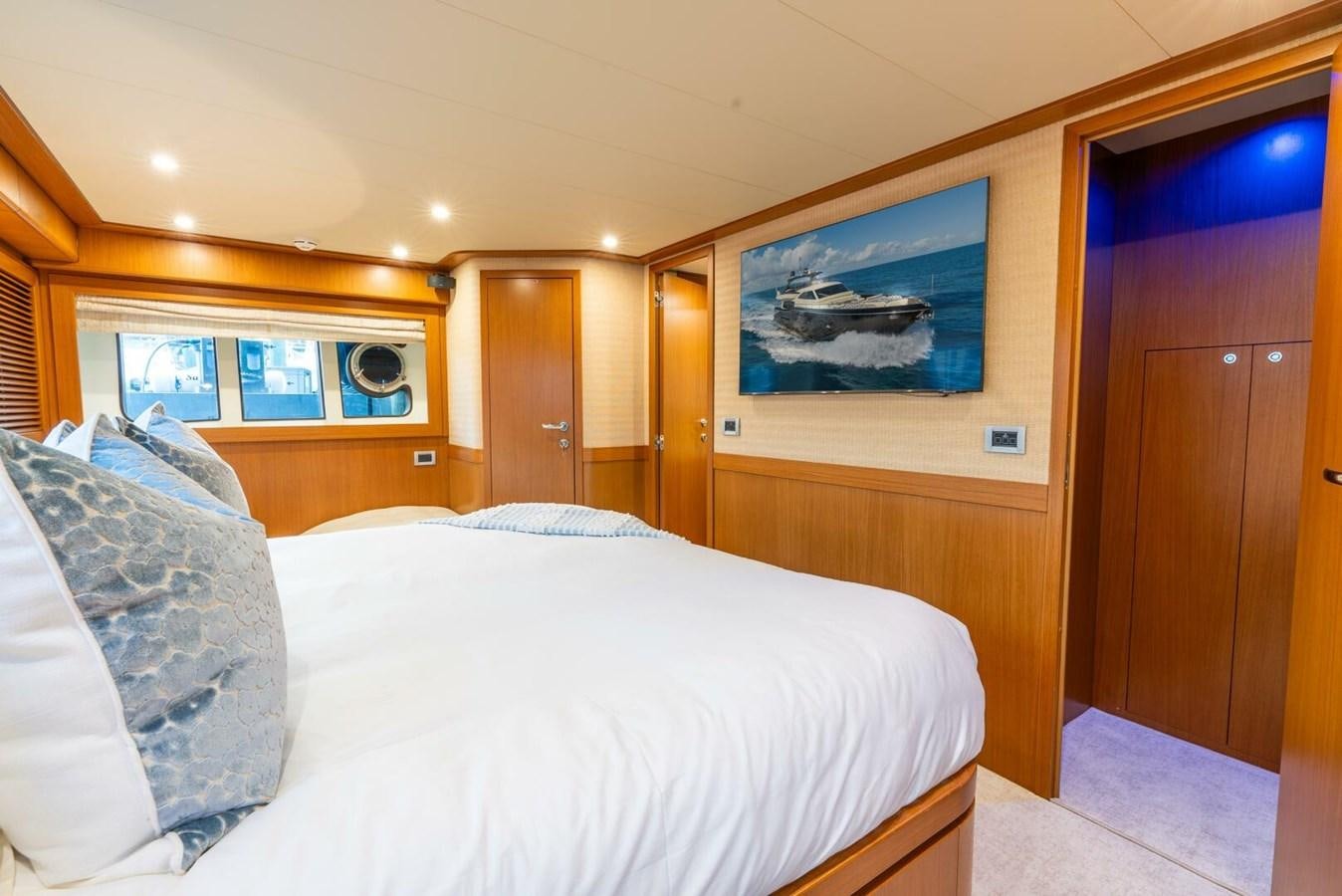 a bedroom with a bed and a painting on the wall aboard ALTURA 840 Yacht for Sale