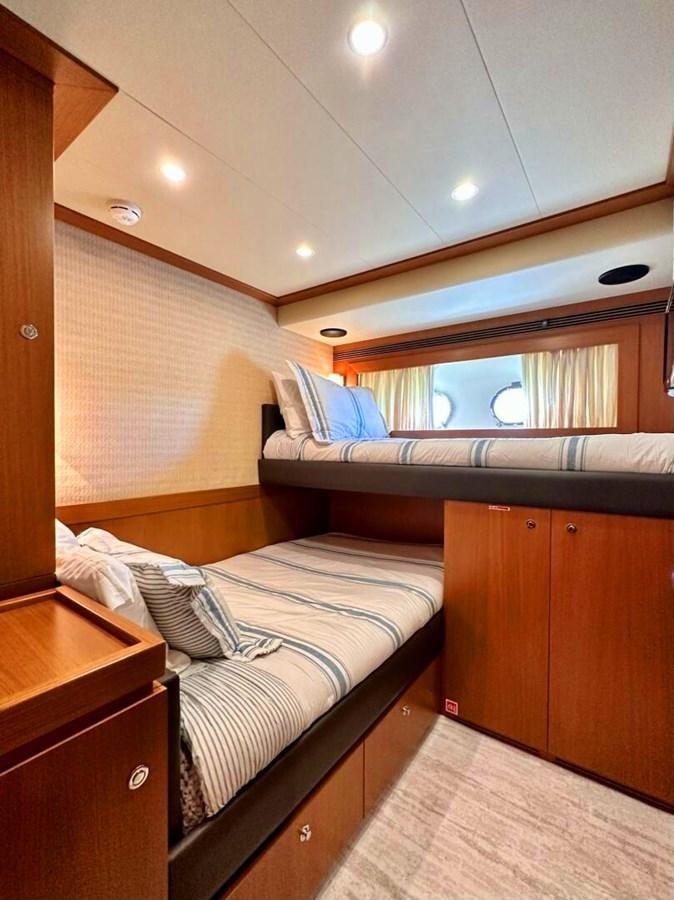 a room with a bed and a window aboard ALTURA 840 Yacht for Sale