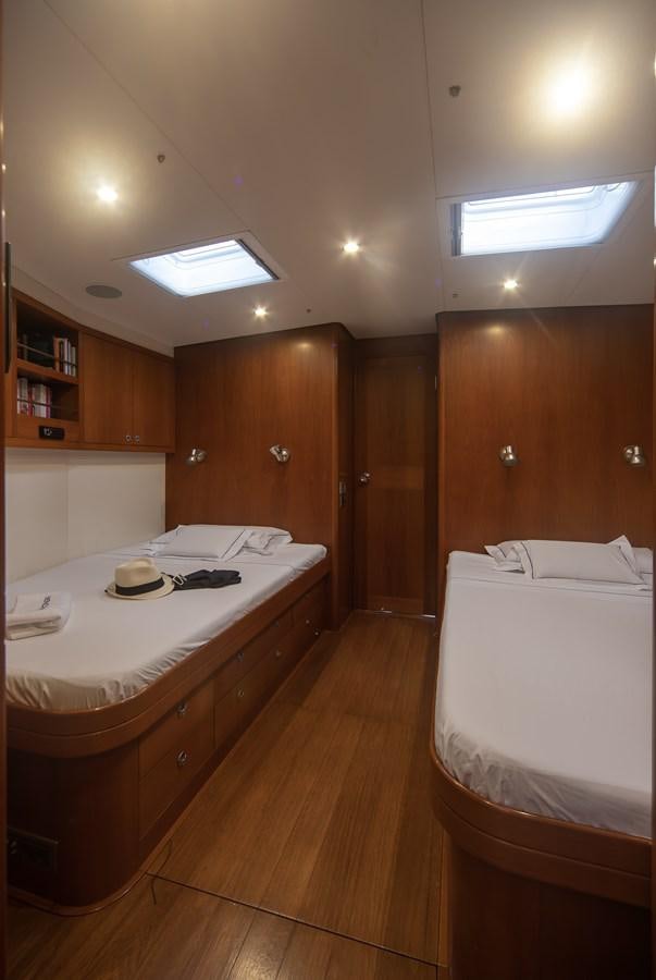 a bathroom with a large sink and a bed aboard TURCONERI Yacht for Sale