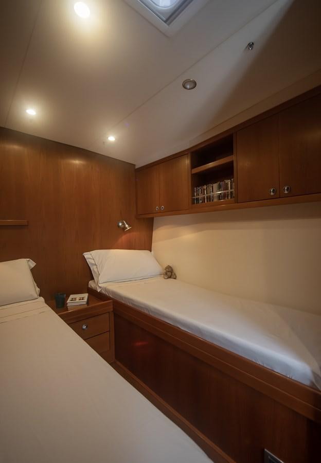 a room with a couple of beds aboard TURCONERI Yacht for Sale