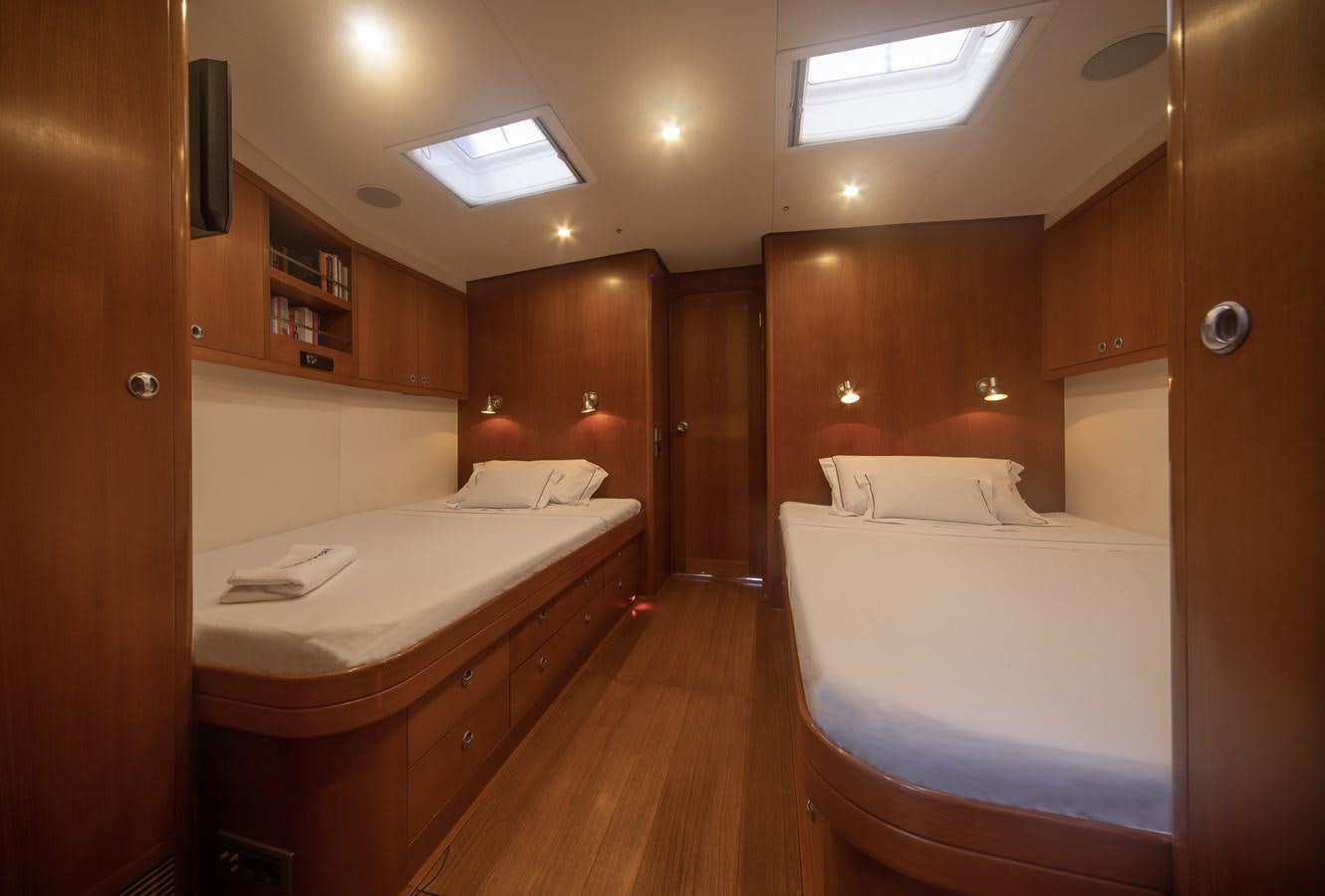 a room with a bed and a desk aboard TURCONERI Yacht for Sale