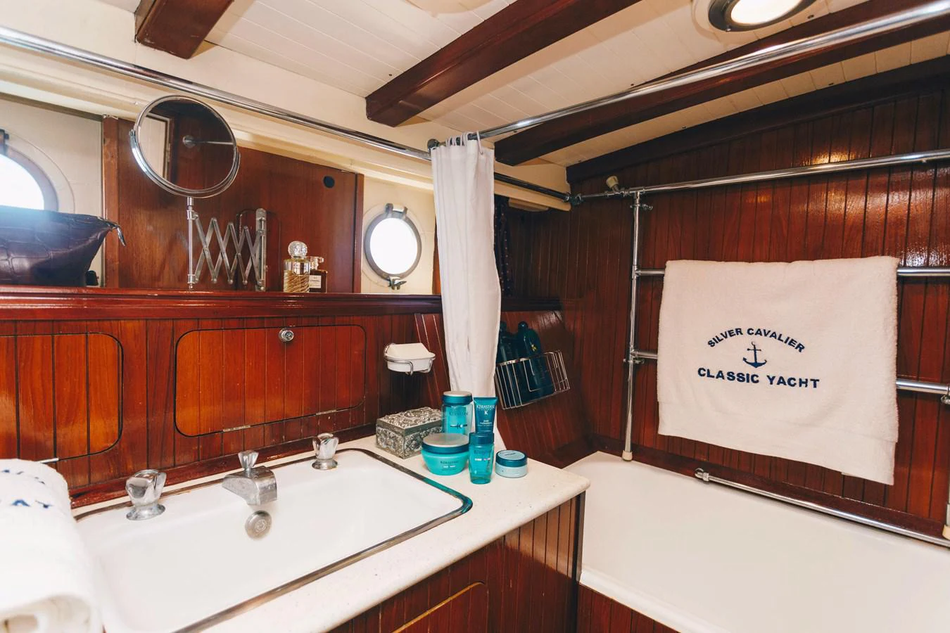 a bathroom with a sink and mirror aboard SILVER CAVALIER Yacht for Sale