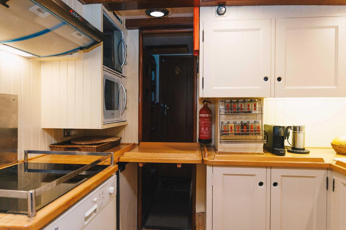 a kitchen with white cabinets aboard SILVER CAVALIER Yacht for Sale